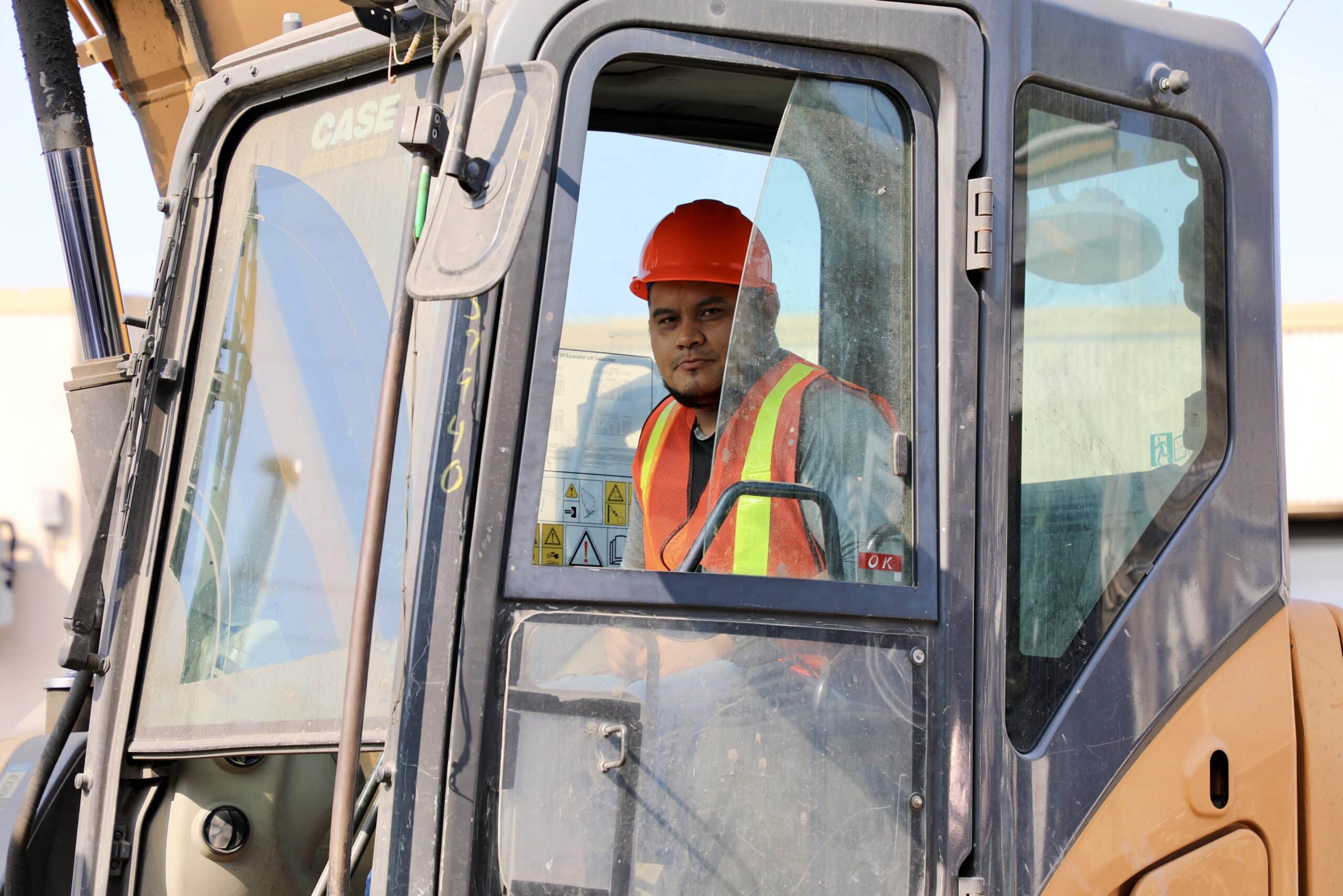 Employee in fork lift with hard hat